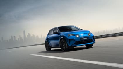 a blue car on a road