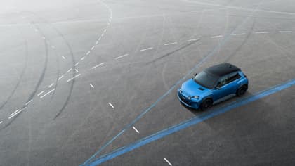 a blue car on a road