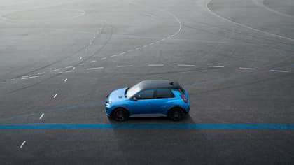 a blue car on a road