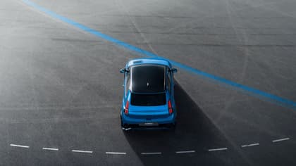 a blue car on a road