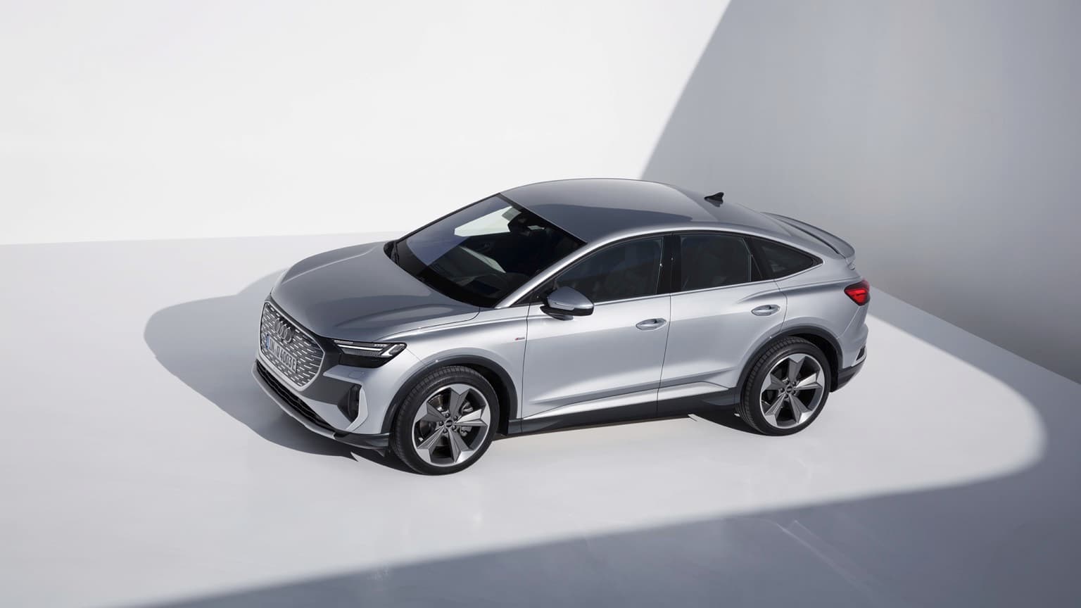 a silver car parked in a room