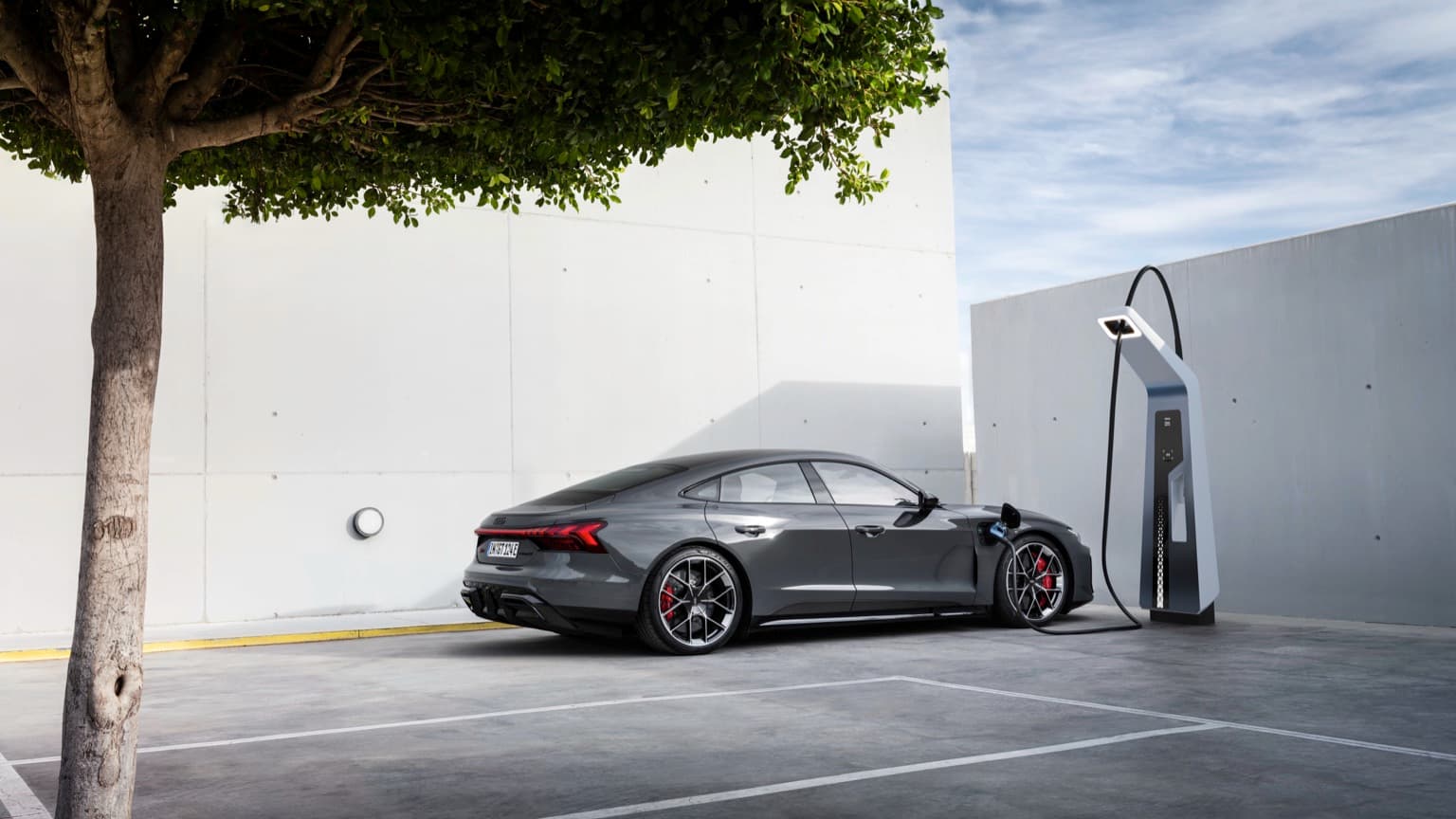 a car charging at a charging station