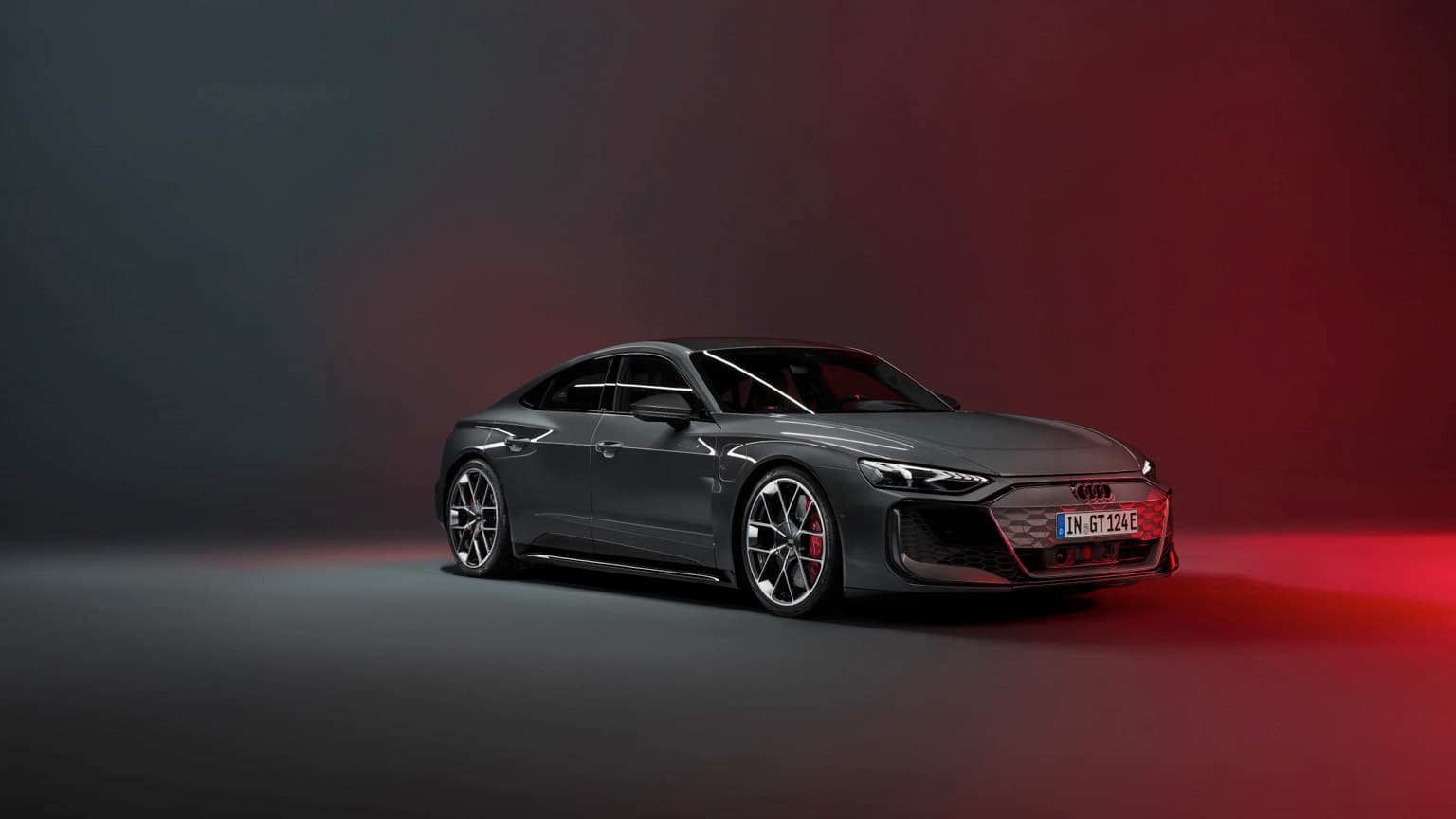 a black sports car with red and black lights