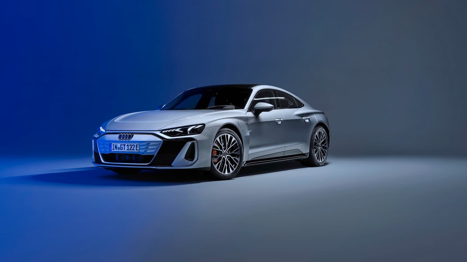 a silver car with a blue background