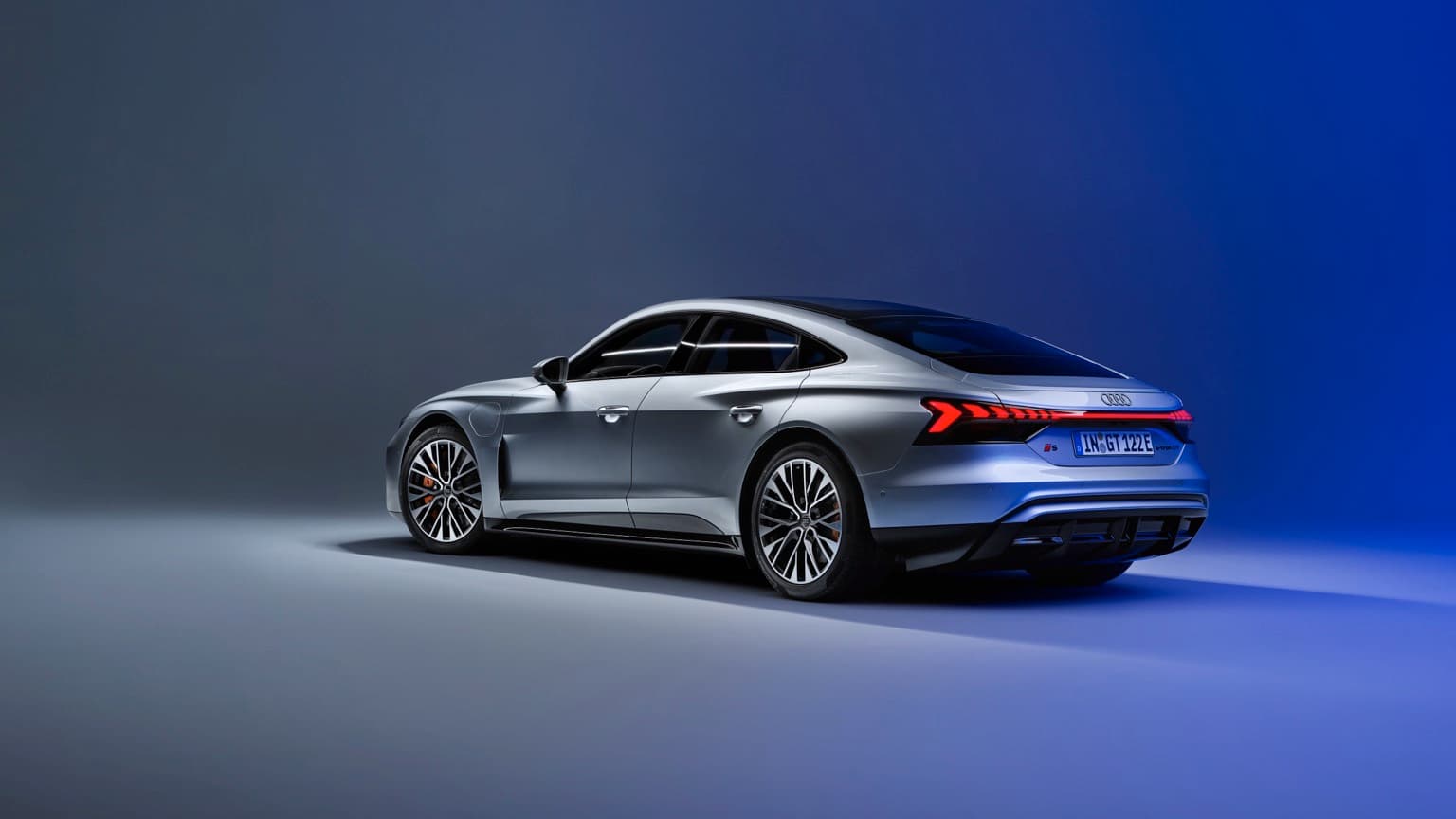 a silver car with a blue background