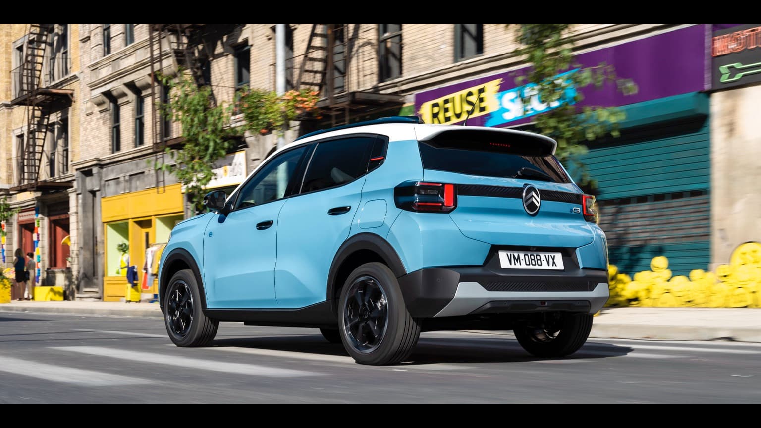 a blue car on the street