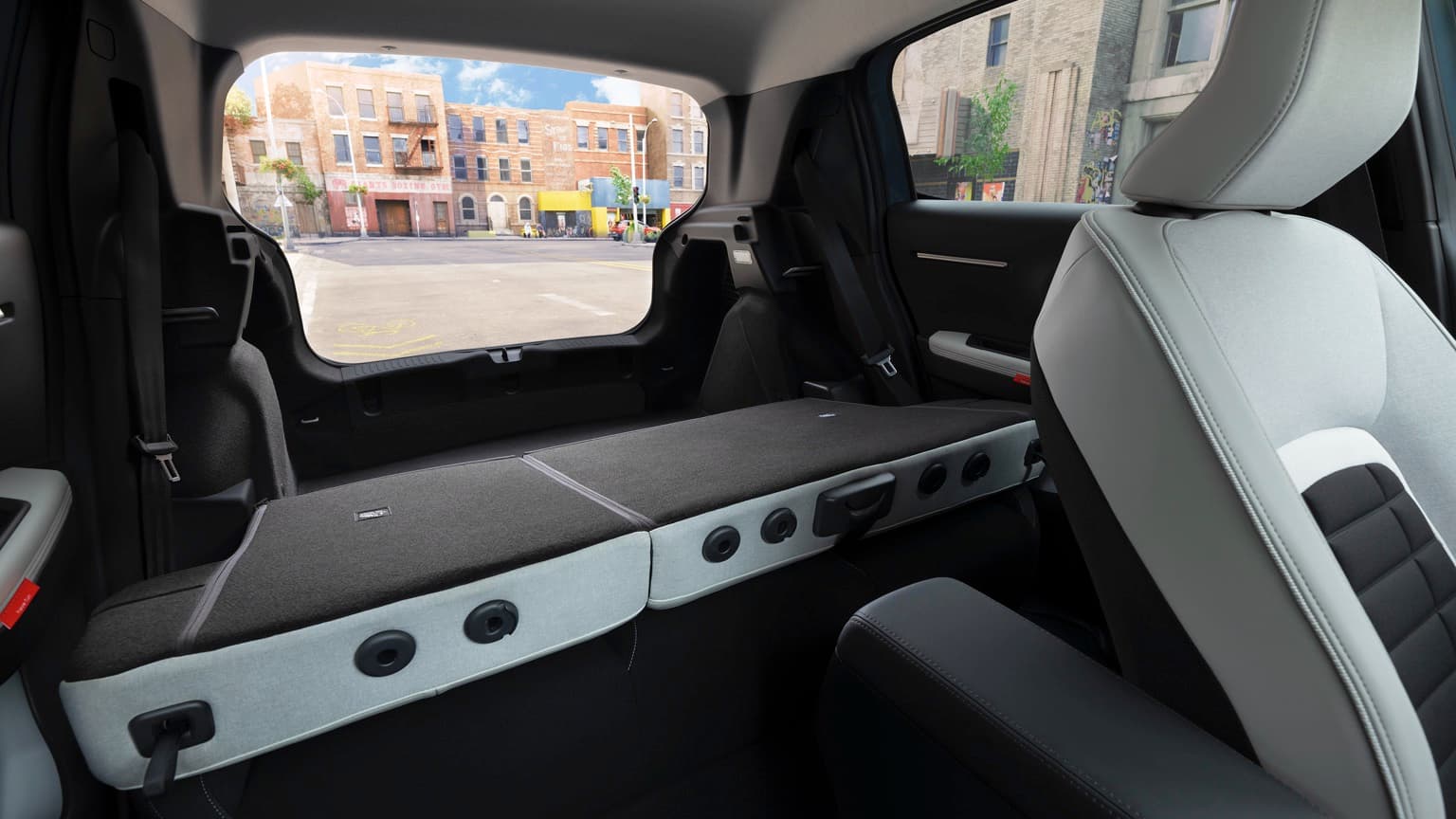 the inside of a car with a seat and a window
