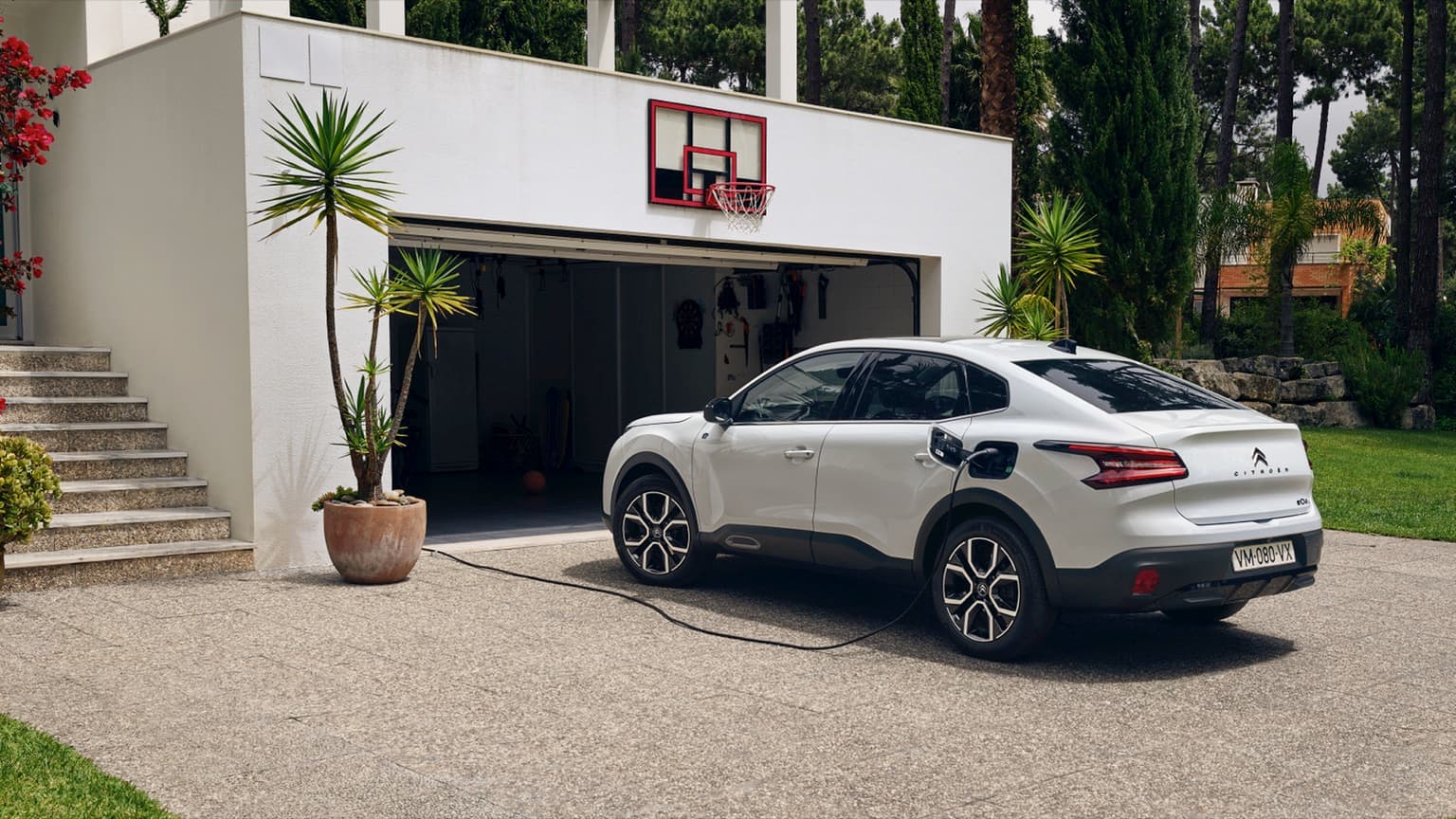 a car charging at a garage