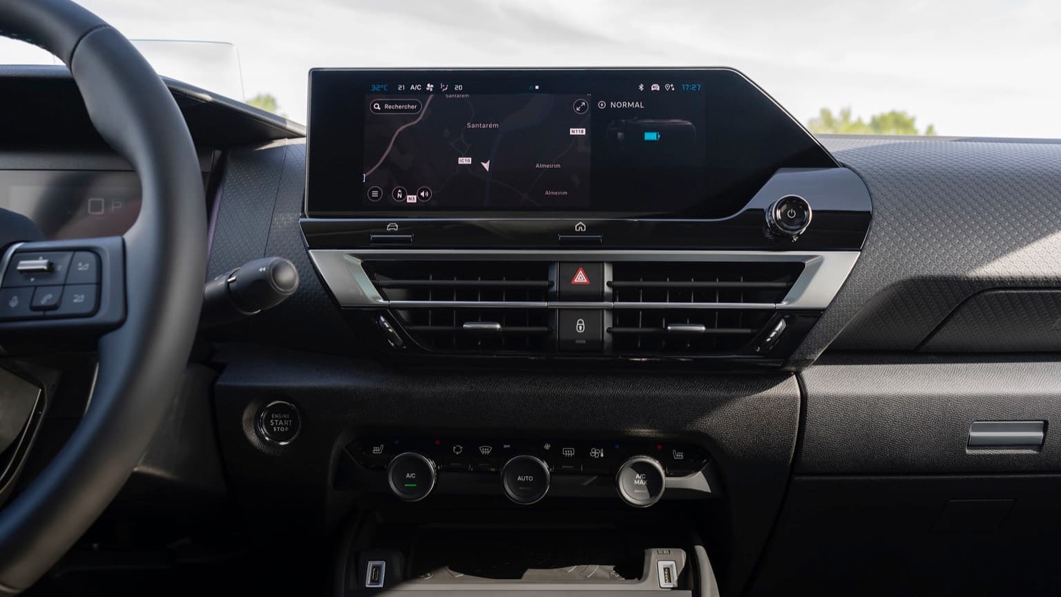 a car dashboard with a screen and buttons