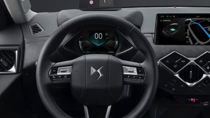 the steering wheel and dashboard of a car