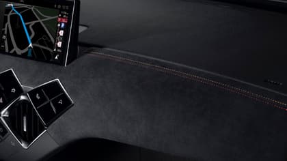 a phone on the dashboard of a car
