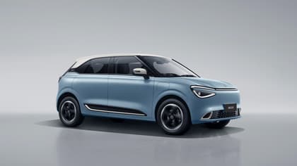 une voiture bleue avec un toit blanc
