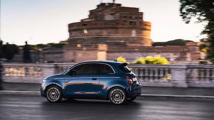 a blue car on a road