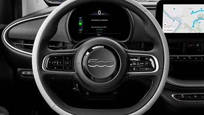 the steering wheel and dashboard of a car