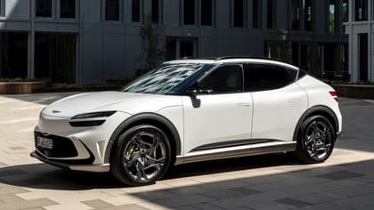 a white car parked on a sidewalk