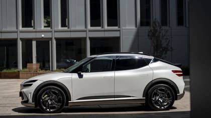 a white car parked on a brick surface