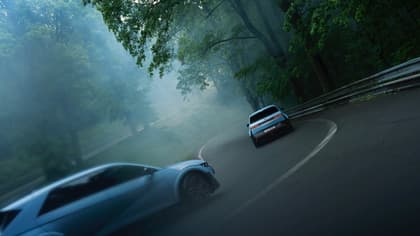 two cars driving on a road