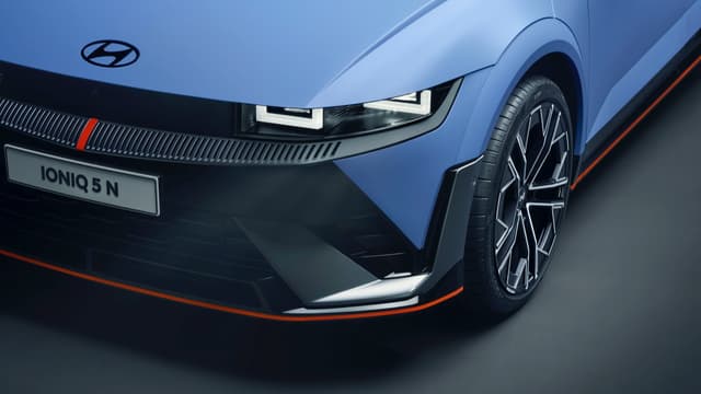 the front end of a blue car