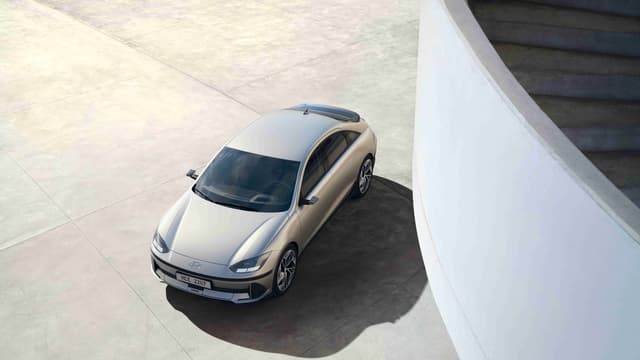 a silver car parked on concrete