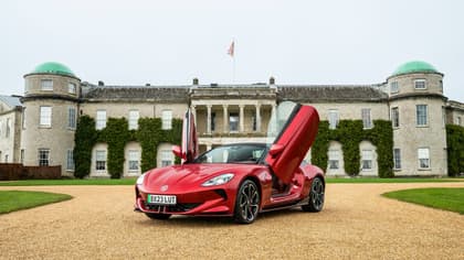 a red sports car with doors open