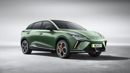 a green car parked on concrete