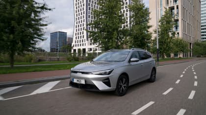 a silver car on a road