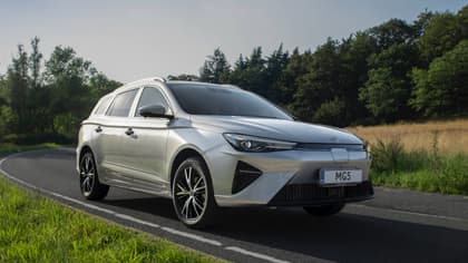 a silver car on a road