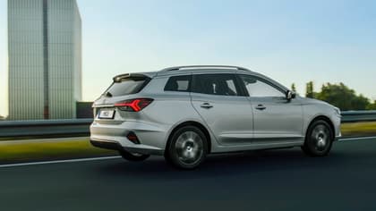 a silver car on a road