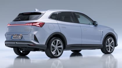a silver suv with black wheels