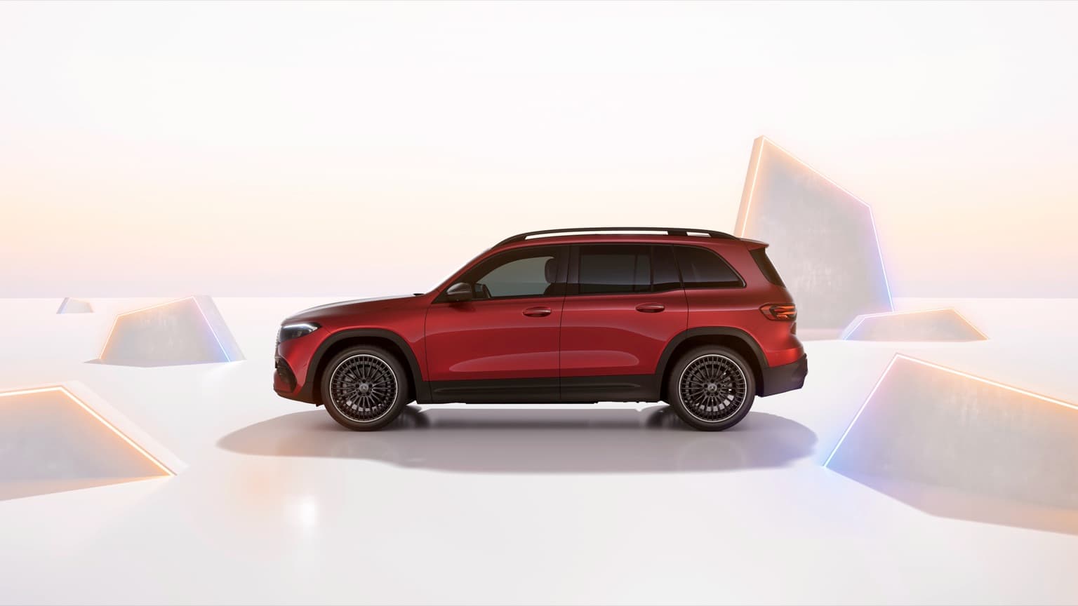 a red car parked in front of a pyramid