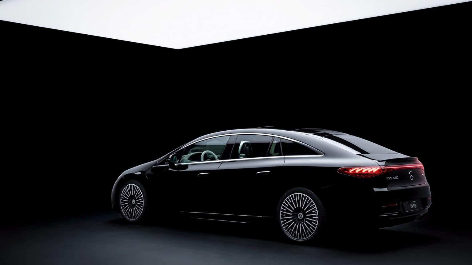 a black car in a dark room