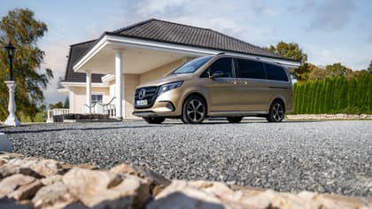 a van parked in front of a house