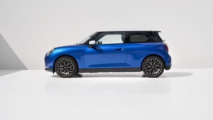 a blue car with black rims