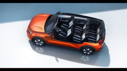 an orange car with the open doors