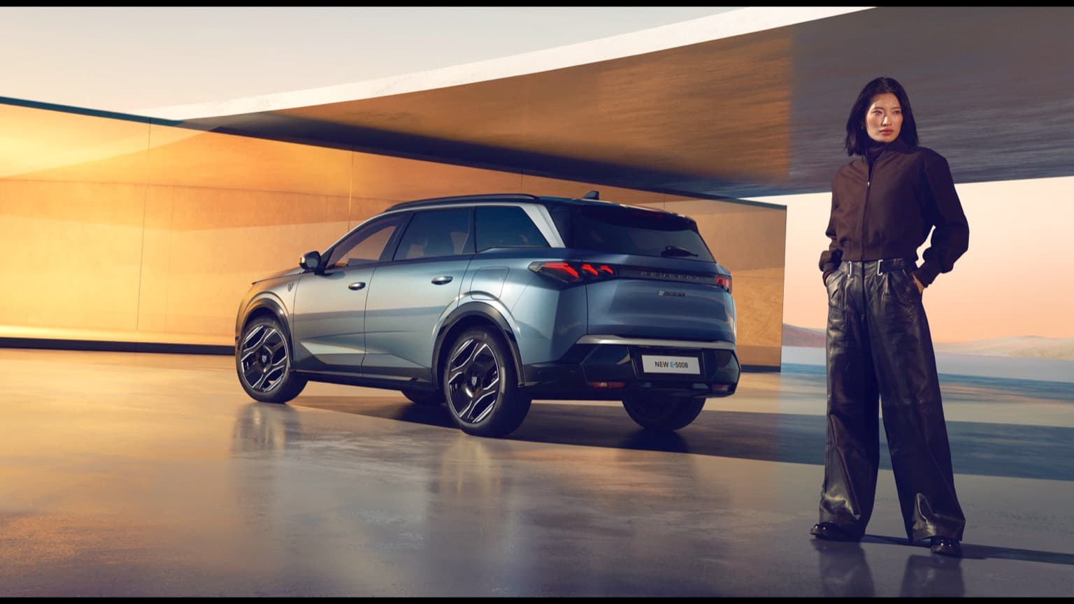 a man standing next to a car