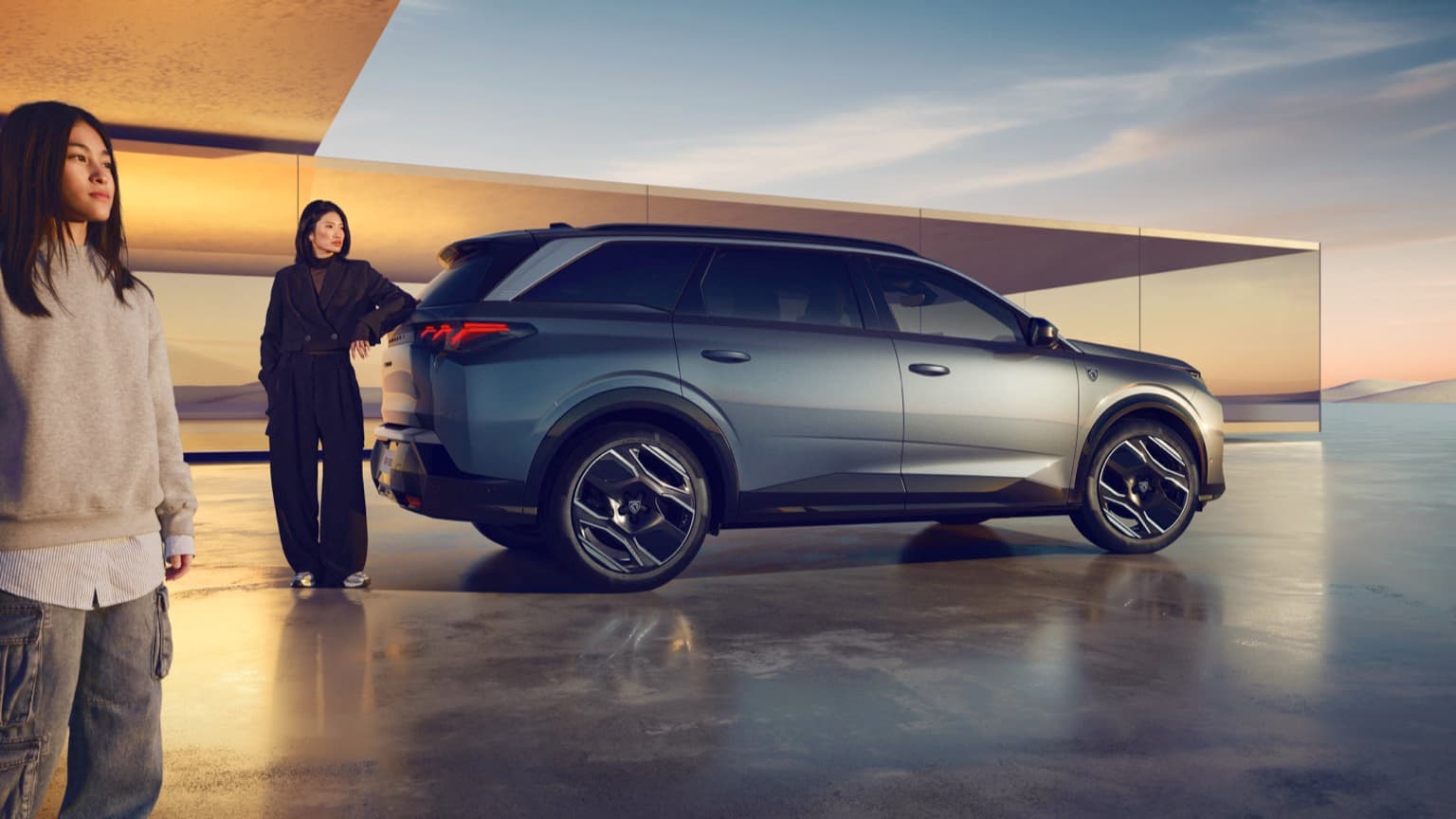 a woman standing next to a car