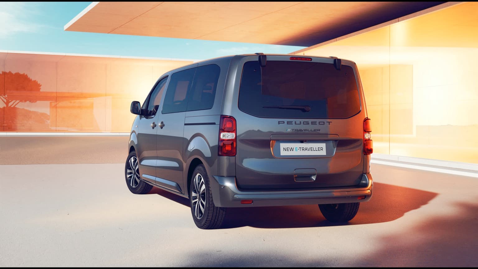 a grey van parked in a parking lot