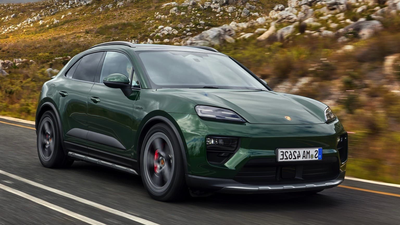 a green car on a road