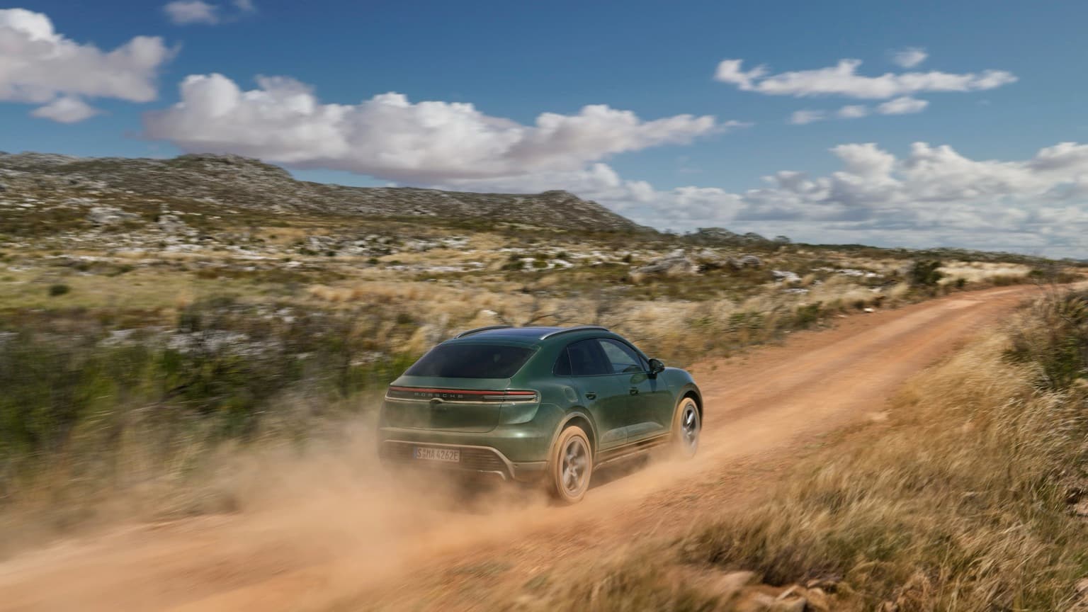 a car driving on a dirt road