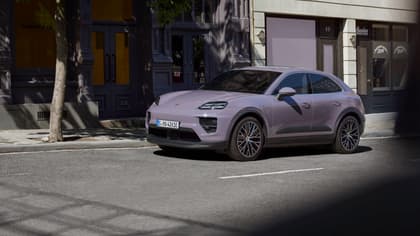 a purple car parked on the side of a road