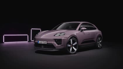a purple car parked in a dark room