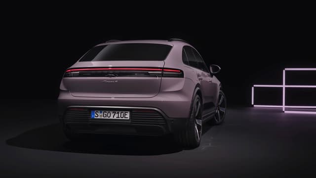 a purple suv in a dark room