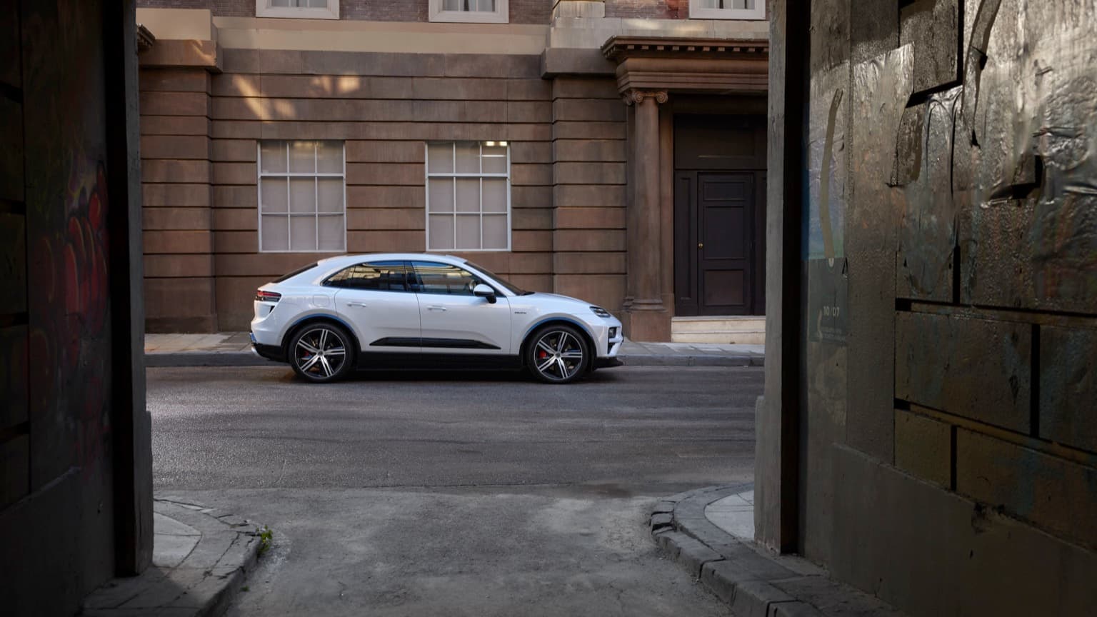 a white car parked on the side of a road