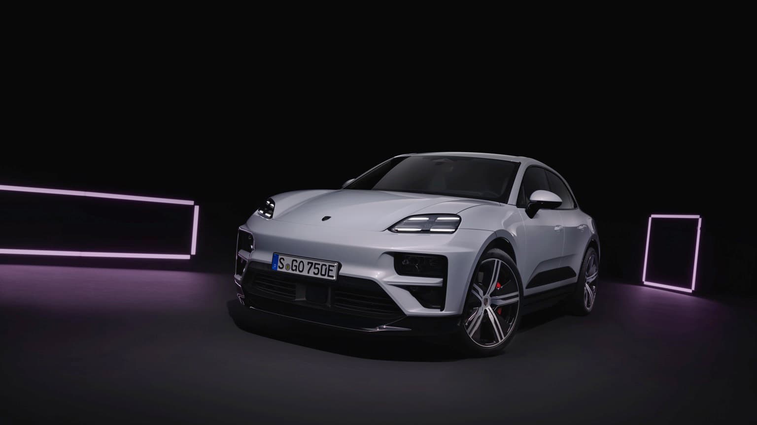 a white car in a dark room