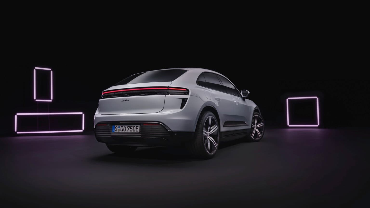 a car parked in a room with neon lights