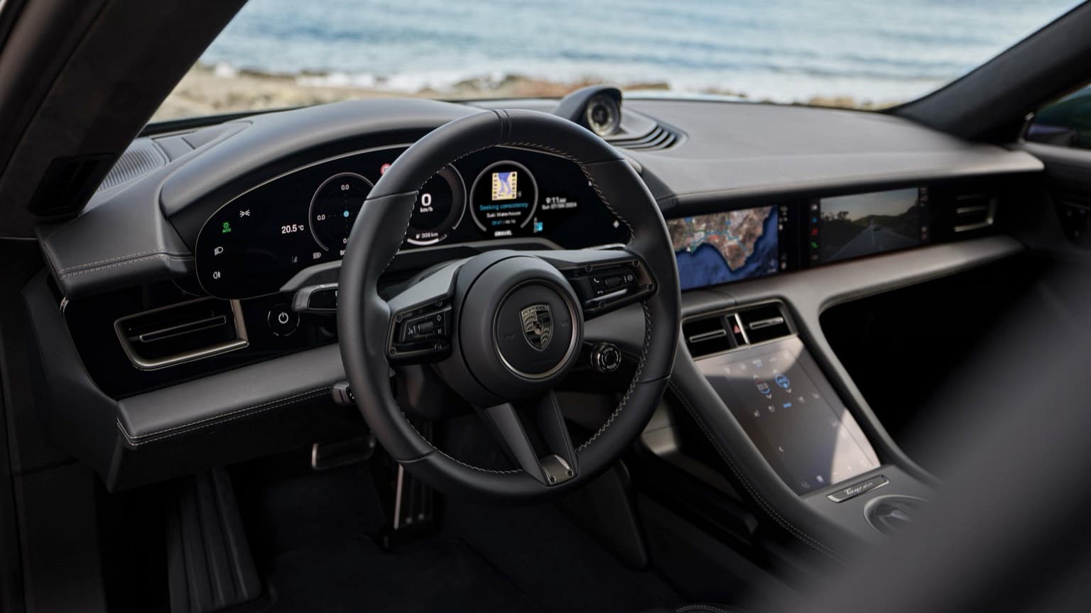 the interior of a car with a steering wheel and dashboard