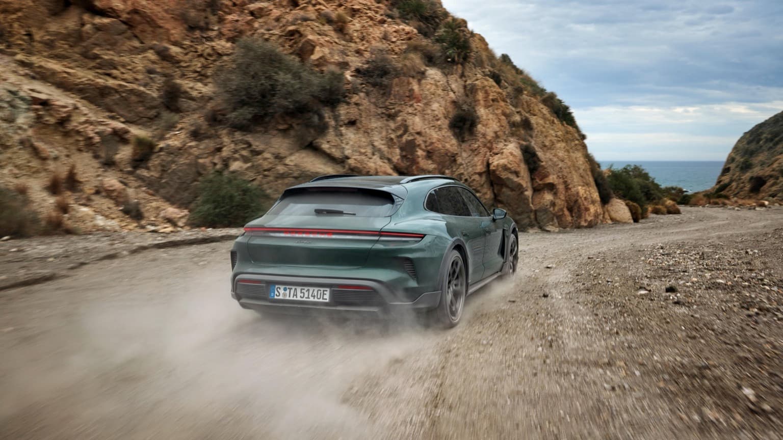 a car driving on a dirt road