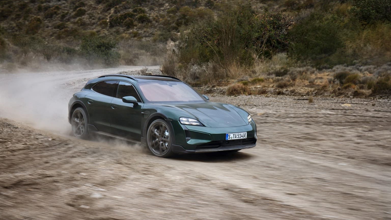 a car driving on a dirt road