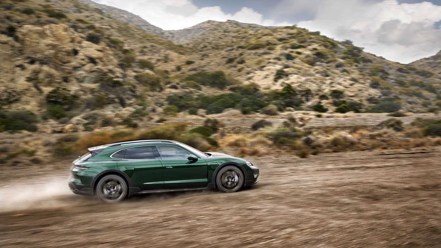 a car driving on a dirt road