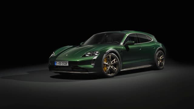 a green sports car with a black background